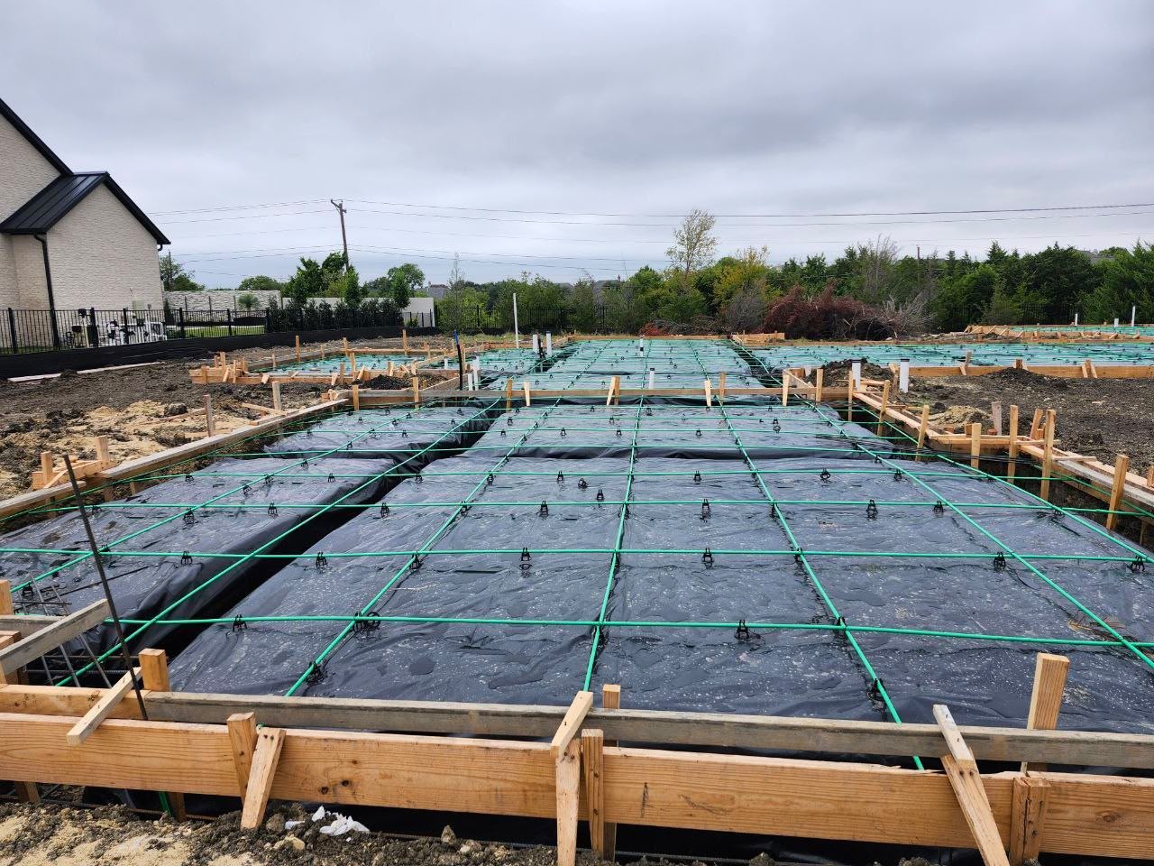 Foundation prepared for concrete placement with formwork and post-tension cables